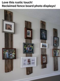 a wall with pictures and frames hanging on it's side, which is covered in wood planks