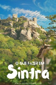 a castle on top of a hill with the words sintra in front of it