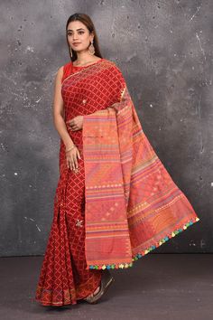 Shop this classy red hand painted madhubani cotton saree online in USA. Perfect to be worn as part of your everyday work wear, with this hand-painted red Madhubani saree, elegance meets traditional. Add this designer Lambani embroidery designer saree with colored tassels to your collection from Pure Elegance Indian Fashion Store in USA.- Full view with open pallu. Madhubani Saree Designs, Madhubani Hand Painted Saree, Semi-stitched Red Saree With Block Print, Red Semi-stitched Saree With Printed Motifs, Madhubani Print Saree, Cotton Sarees Online, Fashion Journals, Traditional Fabric, Traditional Attire