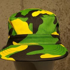 Green Black And Yellow Hat. Sizes Small And Medium. Military Style Hat For Streetwear, Green Military Flat Cap, Military Camouflage Bucket Hat, Military Style Camouflage Bucket Hat, Military Style Green Flat Cap, Green Military Bucket Hat With Short Brim, Green Military Brimmed Hat, Casual Camouflage Flat Cap, Green Military Bucket Hat