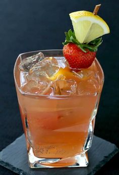 a strawberry lemonade cocktail garnished with an orange slice