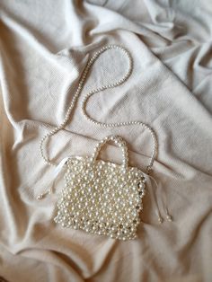 Pearl Beaded Bag, Pearl Wedding Bag Handbag Shoulder Bag, Pearl Purse, Pearl Evening Bag, Beaded Bag, Gift For Her, Bridal Bag, Removable Strap and with satin pouch Attention! Measurements in photos are in centimeters. In this shop, I produce stylish and timeless bags with my imagination. My bags are the combination of natural materials and handcraft. I design useful and different models with love. I can improve myself with your ideas and suggestions and produce bags according to your wishes. Le Square Wedding Bag With Pearl Handle, Pearl White Rectangular Wedding Bag, Wedding Bag With Pearl Embroidery, Handheld Pearl Bag For Wedding, Wedding Pearl Beaded Bags, Pearl Beaded Wedding Bags, Beige Pearl Bags For Wedding, Pearl Beaded Bags For Wedding, Beige Pearl Wedding Bags