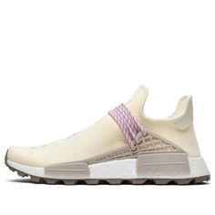 The Adidas Pharrell x N.E.R.D. x NMD Human Race Trail Cream is a unique and stylish sneaker that is perfect for anyone who loves to stand out from the crowd. With its mismatched design and bold colors, this sneaker is sure to turn heads no matter where you go. The comfortable and supportive construction makes it ideal for long days on your feet, while the Lugged rubber outsole provides superior traction on any surface. Whether you're hitting the streets or the trails, the Adidas Pharrell x N.E.R.D. x NMD Human Race Trail Cream is perfect for any adventure. (SNKR) Custom Cream Sneakers With Rubber Sole For Sports, Beige Running Shoes With Boost Midsole For Streetwear, Adidas Cream Sneakers With Contrast Sole, Cream Sneakers With Rubber Sole For Light Sports, Adidas Cream Sneakers With Gum Sole, Cream Sneakers With Boost Midsole For Light Sports, Custom Cream Lace-up Sneakers With Boost Midsole, Cream High-top Running Shoes With Boost Midsole, Beige Sneakers With Boost Midsole For Outdoor