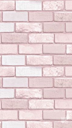 a pink brick wall with white bricks on it