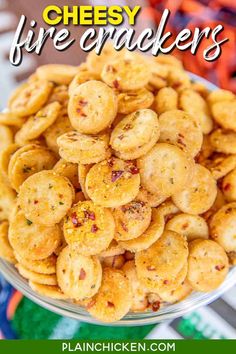 a bowl filled with crackers sitting on top of a table next to a football field