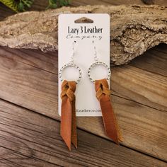 These leather earrings are such a fun shape with their classic saddle knot. They are very lightweight, like all leather earrings, and come in this light tan color. We make all our earrings in our workshop in Ivins Utah and cut everything we make from Full-grain leather hides. These earrings have been finished with Sterling silver, 18K gold, or nickel-free earring hooks and hardware. Braided Leather Earrings Diy, Western Leather Earrings, Ivins Utah, Diy Western Jewelry, Leather Earrings Diy, Diy Western, Leather Inspiration, Winter Market, Leather Jewelry Making