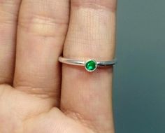 "ARTSMYRNA METAL: 925k Silver GEM: Emerald ( lab created ) Diameter Stone Size: 3 mm COATING: 24k gold over (We can made a special type of coating for your personal preference ) MATERIEL : 925K Sterling Silver ( Some of my items vermeil gold over silver for looks rich . But i can finish in silver too ) RING SIZE: 6 (your desired size is made) GEM FEATURES AND BENEFITS Features : It is the divine gem of Goddess Venus. It is also known as \"Healer Stone\". It has the ability to maintain emotional, Handmade Stackable May Birthstone Rings, Handmade Green Stackable Rings For Gift, Sterling Silver Emerald Ring With Round Band As Gift, Emerald Ring With Sterling Silver Round Band As Gift, Green Solitaire Stackable Rings For May Birthstone, Handmade Green Stackable Rings For May Birthstone, Green Solitaire Minimalist Jewelry, Green Minimalist Stackable Rings With Bezel Setting, Minimalist Green Stackable Rings With Bezel Setting