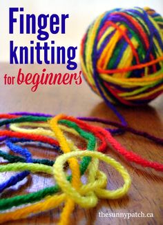 a ball of yarn with the title finger knitting for beginners on top of it