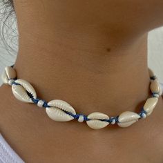 🌊 Dive into Bohemian Elegance! Introducing our Blue Adjustable Cowrie Shell Choker, a vibrant and elegant piece meticulously handcrafted to bring a touch of bohemian chic to your style! This choker is a true reflection of a love for the beach, symbolizing adventure, freedom, and a deep connection with nature. 🏝️ Inspired by the Vibrancy of the Ocean: Crafted with a passion for the vibrant colors of the ocean and the elegance of natural elements, this choker is a celebration of adventure, tranquility, and the timeless beauty of nature. It's a versatile accessory for those who appreciate chic elegance and the lively ambiance of the beach. 🌟 Trendy & Adjustable Design: With its vibrant blue color, adjustable feature, and the timeless appeal of cowrie shells, this choker is a trendy and sop Handmade Blue Jewelry For Beach Party, Blue Jewelry For Summer Vacation, Blue Summer Jewelry For Beach Party, Blue Jewelry For Summer Beach Party, Bohemian Summer Jewelry In Ocean Color, Summer Bohemian Style Blue Jewelry, Bohemian Blue Jewelry For Summer, Summer Bohemian Blue Jewelry, Summer Bohemian Ocean Color Jewelry