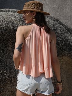 The perfect easy-to-wear summer top that offers style and a casual vibe. Great for festivals and those casual cute days. Features: Ruched, Peplum Sheer: Opaque Stretch: No stretch Material composition: 100% viscose Care instructions: Machine wash cold. Tumble dry low. Peach V-neck Summer Blouse, V-neck Top For Summer Outings, Summer Peach V-neck Blouse, Breezy Flowy Spring Top, Breezy Flowy Top For Spring, Breezy Spring Tops For Day Out, Pink V-neck Crop Top For Summer, Sleeveless Stretch Tops For Summer, Chic Flowy Crop Top For Summer