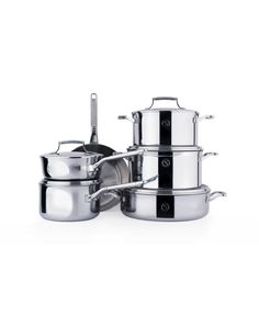 stainless steel pots and pans stacked on top of each other