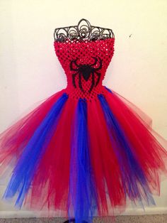 a red, white and blue dress with spiderman on it