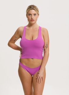 The Racer Back Top, modeled after a sports bra, provides good support and an elegant style that works as well on the beach as off. It pairs well with any of our bottoms but we particularly love it with our Classic Bottom. It's part of our neoprene swimwear collection that uniquely form fits to the body without digging in. It is colorful and bold, yet timeless and classic and creates a second skin when wet and molds to your body in all the right places. Neoprene sizing is very flexible and many s Neoprene Swimwear, Bandeau Top, Swimwear Collection, Racer Back, Second Skin, Ultra Violet, Elegant Style, The Beach, Sports Bra