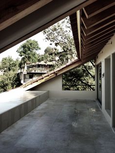 an empty patio with steps leading up to the roof