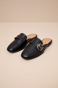 Upgrade your everyday flats with a chic new option like the Lulus Marquete Black Buckle Mule Slides! These too-cute mules have a smooth, faux leather construction that shapes an almond toe upper with a gold buckle strap and matching grommets. Classic notched collar leads to a slide-on design for effortless styling. 0. 75" rubber heel. Cushioned insole. Rubber sole has nonskid markings. Man made materials. Imported. Lulus | Marquete Black Buckle Mule Slides | Size 10. Gold Mules With Buckle Closure For Spring, Spring Gold Mules With Buckle Closure, Trendy Flat Heel Mules With Buckle Closure, Fall Slip-on Mules With Buckle Closure, Fall Buckle Closure Slip-on Mules, Fall Workwear Mules With Buckle Closure, Workwear Buckle Closure Mules For Fall, Workwear Buckle Closure Fall Mules, Workwear Fall Buckle Closure Mules