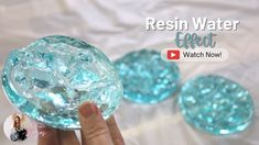 a hand holding a glass ball with ice on it and the words resin water effect next to it