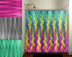 the shower curtain is colorful and has wavy designs on it, along with a black rug