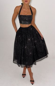 Oh, she's sparkly! You won't find any better than our signature sparkle mesh, a super soft fabric that feels as good as it looks. The Alani skirt is complemented with a full, gathered skirt made with tulle for that extra voluminous look. Make it a dreamy style match with the Alani midi and crop top. 



Colour: Black Sparkle.

Soft sparkle mesh with stretch.

Fully lined.

Full, gathered skirt with tulle for extra volume.

Gathered waistband.

Invisible zipper fastening.

Midi length.

Model is an XS and is wearing an XS.

 Size: XS, S, M, L, XL, XXL Homecoming Dresses Corset, Dreamy Style, Midi Dress Wedding Guest, Gathered Fabric, Long Sleeve Homecoming Dresses, Homecoming Dresses Long, Maxi Dress Sale, Sparkle Dress, Straight Neckline