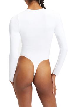 Every closet needs this staple bodysuit made from stretchy scuba fabric with a classic crewneck and long sleeves. Crewneck Long sleeves 80% nylon, 20% elastane Dry clean or machine wash, tumble dry Imported Black Owned/Founded Fitted Bodysuit With Thumbholes And Scoop Neck, Fitted Scoop Neck Bodysuit With Thumbholes, High Stretch Long Sleeve Elastane Leotard, White Stretch Elastane Bodysuit, High Stretch Elastane Bodysuit, White Scoop Neck Elastane Bodysuit, Stretch Elastane Bodysuit With Thumbholes, White Elastane Bodysuit, Fitted Bodysuit With Thumbholes In Elastane