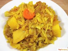 a white plate topped with cabbage and carrots