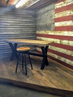 two stools sitting on top of a wooden platform in front of an american flag