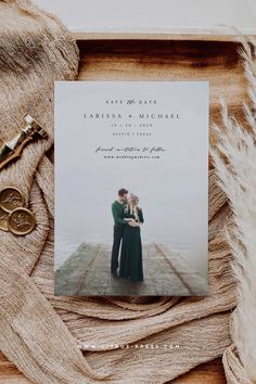 an image of a couple hugging on the pier with their wedding date printed on it