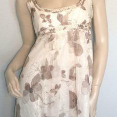 Beautiful Shimmery Ivory Floral Braided Dress Empire Waist New With Tags Cream Silk Sleeveless Midi Dress, Beige Knee-length Lined Dress, Chic Beige Empire Waist Dress, Neutral Fitted A-line Dress, Casual Cream Midi Dress, Cream Lined Dresses For Daywear, Neutral Summer Party Dress, Feminine Sleeveless Cream Maxi Dress, Elegant Flowy Beige Mini Dress