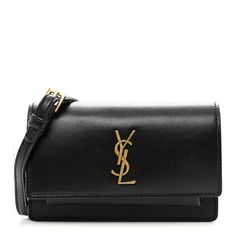 This is an authentic SAINT LAURENT Smooth Calfskin Sunset Baby Belt Bag in Black. This chic belt bag is crafted of smooth calfskin leather in black. It features a removable belt strap that is adjustable and gold hardware. The cross-over flap opens to a compact suede interior with a patch pocket and card slots. Baby Belt, Chic Belt, Belt Bag, Gold Hardware, Patch Pocket, Card Slots, Calf Skin, Slots, Saint Laurent