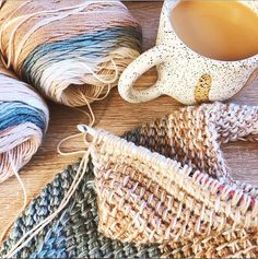 some yarn and a coffee cup on a table