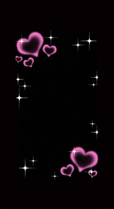 some pink hearts and stars on a black background