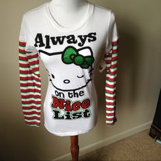 Christmas Long Red Green White Striped Sleeves 60% Cotton 40% Polyester Made In Vietnam Hello Kitty Nwt Winter Cotton Tops With Hello Kitty Print, Hello Kitty Print Crew Neck Top For Winter, Winter Hello Kitty Print Crew Neck Top, Hello Kitty Long Sleeve Cotton Top, Long Sleeve Cotton Hello Kitty Top, Hello Kitty Print Long Sleeve Top For Fall, Fall Hello Kitty Long Sleeve Top, Cute Cotton Holiday Tops, Fun White Winter Tops