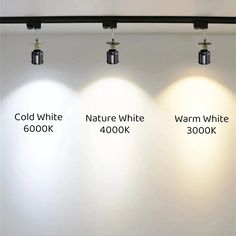 three different types of lights hanging from the ceiling