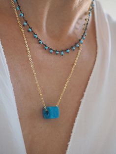 Turquoise necklace, Gold turquoise pendant, Turquoise jewelry, Layered gold necklace, Bridesmaid Necklace, Bridesmaid Gift, Minimalist jewelry, Layering necklace, Tiny Turquoise charm, Howlite gemstone * * * MATERIAL & SIZE * * * - Gold plated chain over 925 sterling silver - - All components are gold plated over sterling silver -Turqoise cube glass bead 4mm x 4mm with hall MATERIALS WE USE AT ALEVIZOU JEWELLERY are sterling silver 925 This lovely dainty charm is a Perfect Necklace for layer Gold Turquoise Necklace With Round Beads For Gift, Gold Turquoise Necklace With Round Beads As A Gift, Turquoise Gemstone Beads Pendant Jewelry, Turquoise Double Strand Gemstone Jewelry, Elegant Turquoise Crystal Necklaces For Jewelry Making, Dainty Rectangular Gemstone Jewelry, Double Strand Turquoise Gemstone Beads Necklace Gift, Double Strand Turquoise Necklace With Gemstone Beads As Gift, Bohemian Jewelry With Rectangular Gemstone Pendant