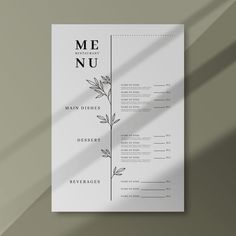 a white menu with leaves on it