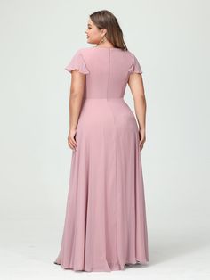 a woman in a long pink dress