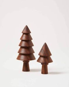 two wooden christmas trees on a white background