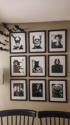 black and white pictures are hung on the wall above two chairs in front of them