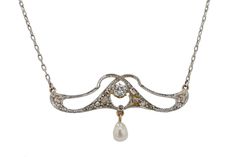 "A beautiful dainty pendant necklace, paying homage to the significant Art Nouveau movement in the early 1900s. A sparkling old European cut diamond sits proudly at its center, while suspended below, a luminous natural freshwater pearl. The platinum openwork is creatively laced above the diamond, creating an asymmetrical and pleasant architecture in this lovely lavaliere. Condition: Very Good Era: Art Nouveau Year: 1910s Metal: Platinum & 18k Yellow Gold Diamonds: Carat Weight: 0.19 Cut: Old European Color: H Clarity: SI2 Accents: 1 Natural Freshwater Pearl 10 Diamonds = 0.08 carats total Pendant Dimensions: 5/8\" H x 1 3/8\" W x 3/16\" D Chain: 18\" x 1mm W Total Weight: 5.6 grams Graded by GIA standards Includes: Certified Appraisal $4,375. Custom box & free expedited shipping. 100% mone Dainty Pendant Necklace, Art Nouveau Antiques, Dainty Pendant, European Cut Diamonds, Antique Diamond, Early 1900s, Custom Boxes, Freshwater Pearls, Gold Diamond