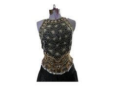 "Silk Sequin Embellished Top. Sleeveless Floral Pattern. Stunning! By Papell evening boutique. Vintage.  1980s. Made in Indian. Zip up back. Beautifully detailed top. Hand beaded floral pattern is stunning.  Unique and upscale. In excellent condition.  Womens Size: M Measures:  38\" bust 34\" waist 22\" length" Embellished Sleeveless Evening Vest, Evening Embellished Sleeveless Vest, Vintage Embellished Sleeveless Top, Vintage Sleeveless Evening Top, Vintage Party Vest For Summer, Vintage Summer Party Vest, Sequin Embellished Top, Embellished Top, Sequin Top