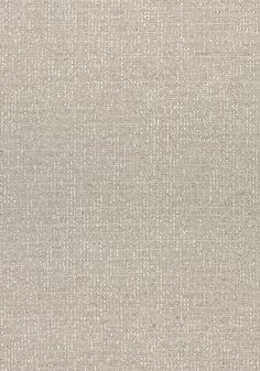 an upholstered fabric textured with small dots in light grey and off white