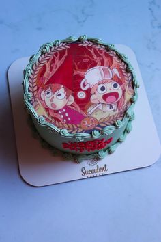 the cake is decorated with cartoon characters on it