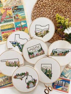 embroidery kits with embroidered state images on them