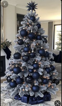 a christmas tree with blue and silver ornaments