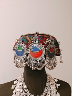 Handmade Afghan Halima Sultan Cap Head Jewelry Mathapatti ALERT!! Heavy Cap, heavily embellished A beautiful handmade afghan head jewelry is here. The afghan artisans residing in Pakistan make these beautiful caps. These are beautiful and one of a kind. There are vintage embellishments attached and beautiful hangings attached to the front. The cap covers the forehead, but it varies from person to person. This goes well with traditional afghan dresses and jewelry.  In addition, these can be perfe Bohemian Adjustable Headpiece With Round Crown, Adjustable Festival Hat Headpiece, Bohemian Festival Hat With Headband, Traditional Adjustable Mini Cap Hat, Silver Bohemian Hat For Festival, Bohemian Silver Hat For Festivals, Adjustable Mini Hat With Round Crown For Festival, Traditional Adjustable Cap Headpiece, Traditional Adjustable Costume Hat With Round Crown