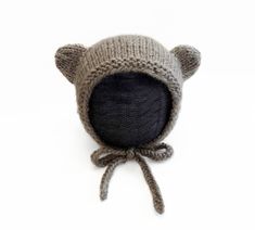 This finished knit baby bear bonnet is the perfect accessory for your little cub. Made from soft and warm yarn, the bonnet is not only cute but also practical for keeping your baby's head warm and cozy. The bonnet ties securely under the chin to ensure a snug and comfortable fit. Whether you're looking for a unique and handmade gift for a new parent or want to treat your own little one, this finished knit baby bear bonnet is a great choice. Size: 3-6 Months Dimensions: Depth: 5.75 inches Height: 6.25 Inches Tie length: 10 inches Made with 100% acrylic yarn Message me for another size! Adjustable Soft Knit Cozy Bonnet, Cozy Adjustable Soft Knit Bonnet, Baby Bonnet Pattern, Knit Bonnet, Baby Bar, Bonnet Pattern, Tie Length, Alpaca Yarn, Baby Head