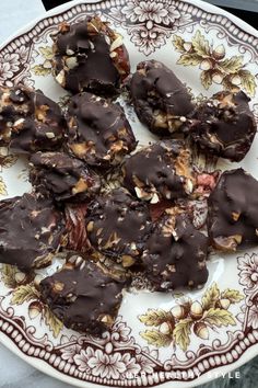 a white plate topped with chocolate covered cookies