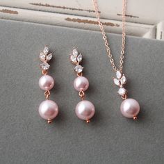 Wedding jewelry set  Prom jewellery Colour:  rose gold-copper/clear/rosaline pink Measurements:   -earrings approx  4 cm ( not very large) -necklace approx 16 inches(+1.5 inches)  Materials: all components rose gold over brass,small clear zirconia, Austrian rosaline pink faux pearls(8 and 10mm)  Great for wedding or other celebration. MORE JEWELRY: https://www.etsy.com/uk/shop/ArtDecoByDonatale?ref=seller-platform-mcnav&search_query=jewelry HAIR ACCESSORIES: https://www.etsy.com/uk/shop/ArtDecoB Pink Bridal Jewellery, Sloth Ring, Prom Jewellery, Bridal Jewellery Set, Wedding Jewelry Set, Jewelry Hair Accessories, Large Necklace, Prom Jewelry, Pink Bridal