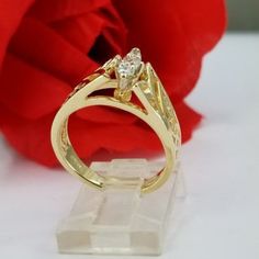 Beautiful engagement ring in 14k gold with three round synthetic zircon stones. Such a beautiful ring for only $379.00. Ring size is adjustable, please note the size in the personalization section of checkout. Hermoso anillo de compromiso en oro de 14k con tres piedras redondas circonias sintéticas. Un anillo tan hermoso por solo $379.00. El tamaño del anillo es ajustable, porfavor anote el tamaño en la sección de personalización en la compra. Elegant Gold Engraved Ring With Diamond Accents, Elegant Yellow Gold Engraved Ring With Diamond Accents, Elegant Engraved Yellow Gold Ring With Diamond Accents, Promise Rings With Vs Clarity And Marquise Shape, Gold Three Stone Princess Cut Diamond Ring, Marquise Rings With Vs Clarity For Promise, 14k Gold Diamond Ring For Promise, Gold Princess Cut Diamond Ring With Three Stones, Gold Princess Cut Three Stone Diamond Ring