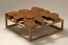 a wooden table that is shaped like a flower