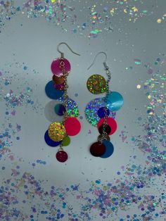 "Fun! Circle Sequin Earrings! In Gold & Silver! ~Made from circle sequin mix with gold or silver split rings, gold or silver drop chain and gold or silver fish hook earrings. ~Circle mix includes lil circles, medium circles and large circle shapes in a variety of colors! ~All color of and placement of sequins are random and asymmetric :) ~Earrings measure 3\" inch in drop length roughly by about a 1/2\" inch in width roughly." Handmade Artsy Circle Earrings, Sequin Crafts Diy, Handmade Multicolor Beaded Circle Earrings, Fun Multicolor Round Beads Earrings, Everyday Multicolor Circle Earrings, Multicolor Circle Earrings With Dangling Beads, Sequins Earrings, Sequin Earrings, Sequins Diy